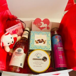 XO Experience- 6 oz scented candle , Small banrock wine, pocket hug card, bath & body works body spray , chocolate , teddy bear keyring, small undated planner  with pen